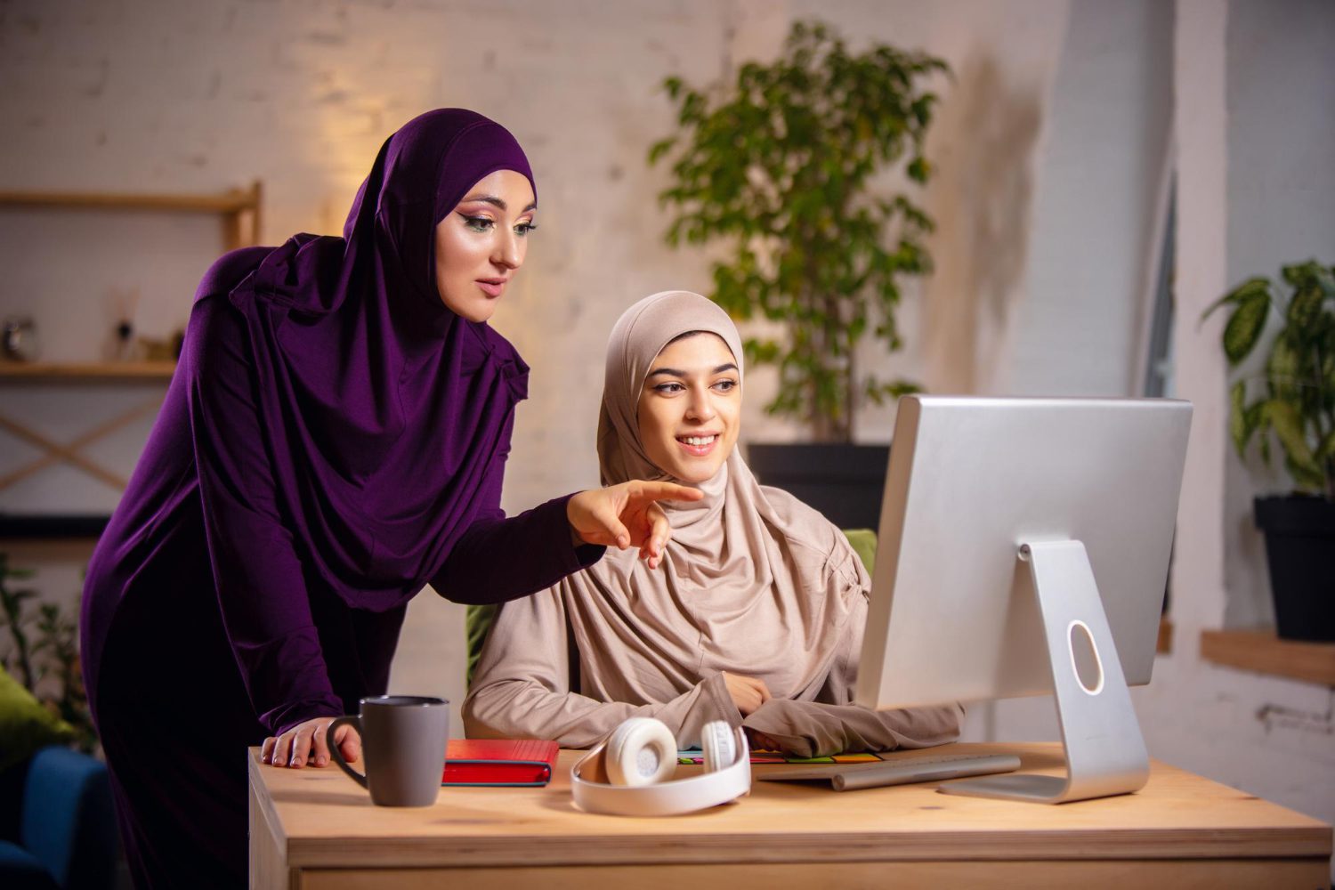 happy muslim woman home during online lesson